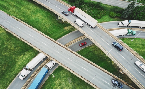 Aerial view of a relatively busy highway overpass section